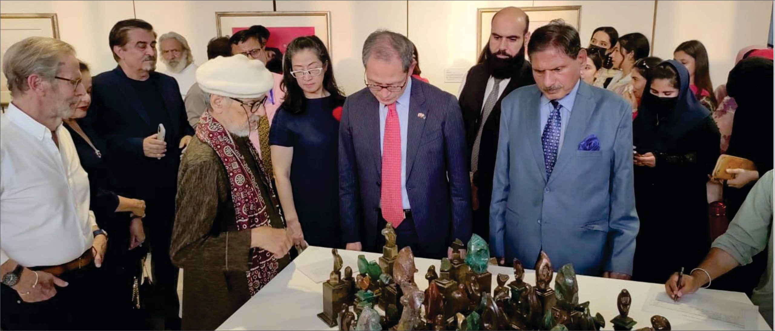 H.E. Mr. Shuichi Akamatsu, Ambassador of Japan to Pakistan, and Mr. Jamal Shah, President of PJCA, with artist Ustad Bashir Ahmed, viewing his artworks at the “Remains of the Ruins” exhibition, SRCC, Islamabad (Sept 24, 2025).